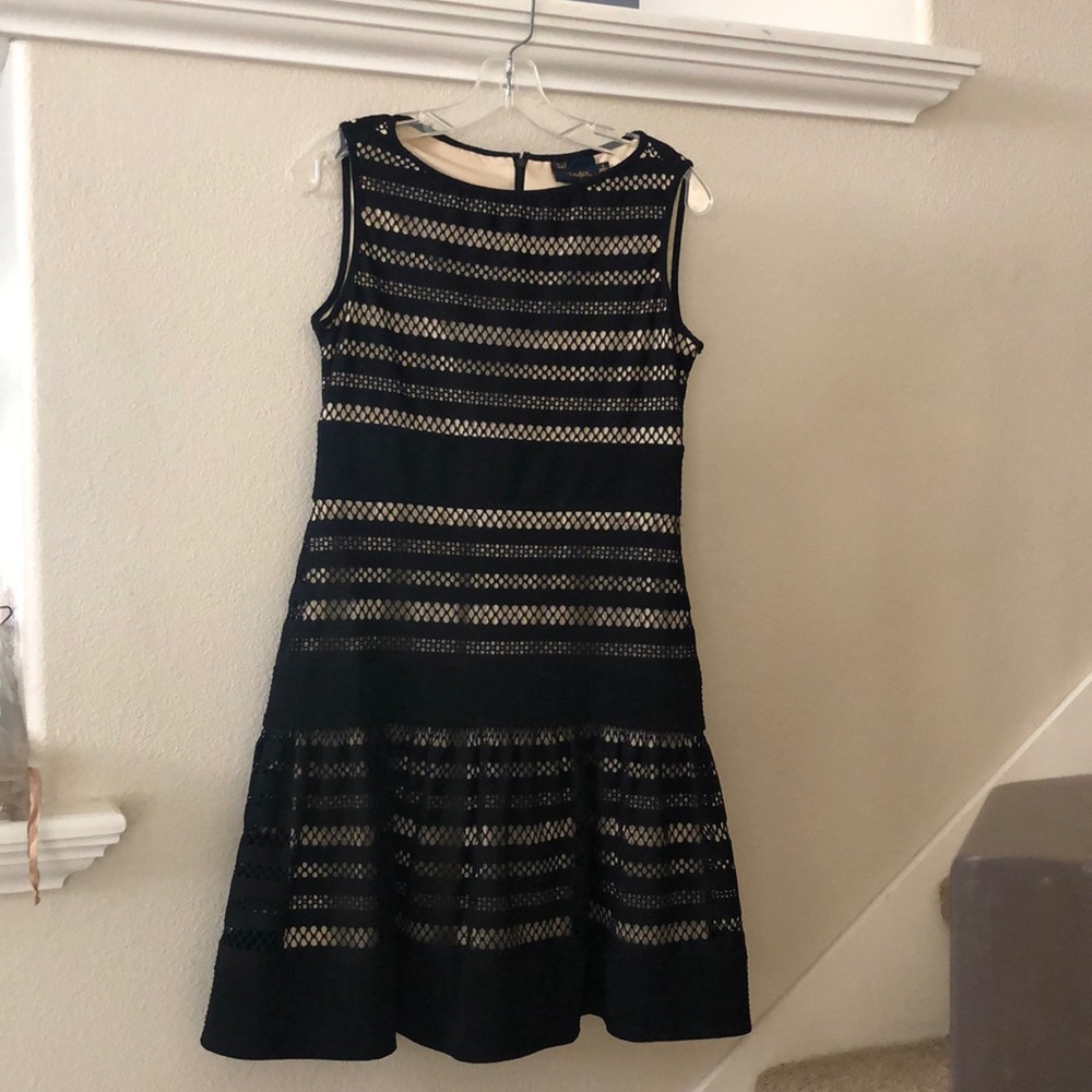 Crocheted black dress with flounce skirt.